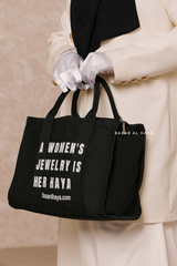 “A Women’s Jewelry Is Her Haya” Black Cotton Tote Bag